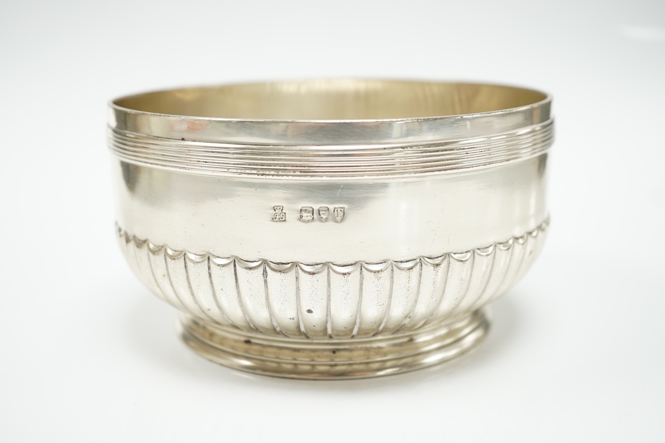 A late Victorian demi fluted silver circular bowl by R & S Garrard & Co, London, 1894, 14.1cn diameter, 14.6oz.